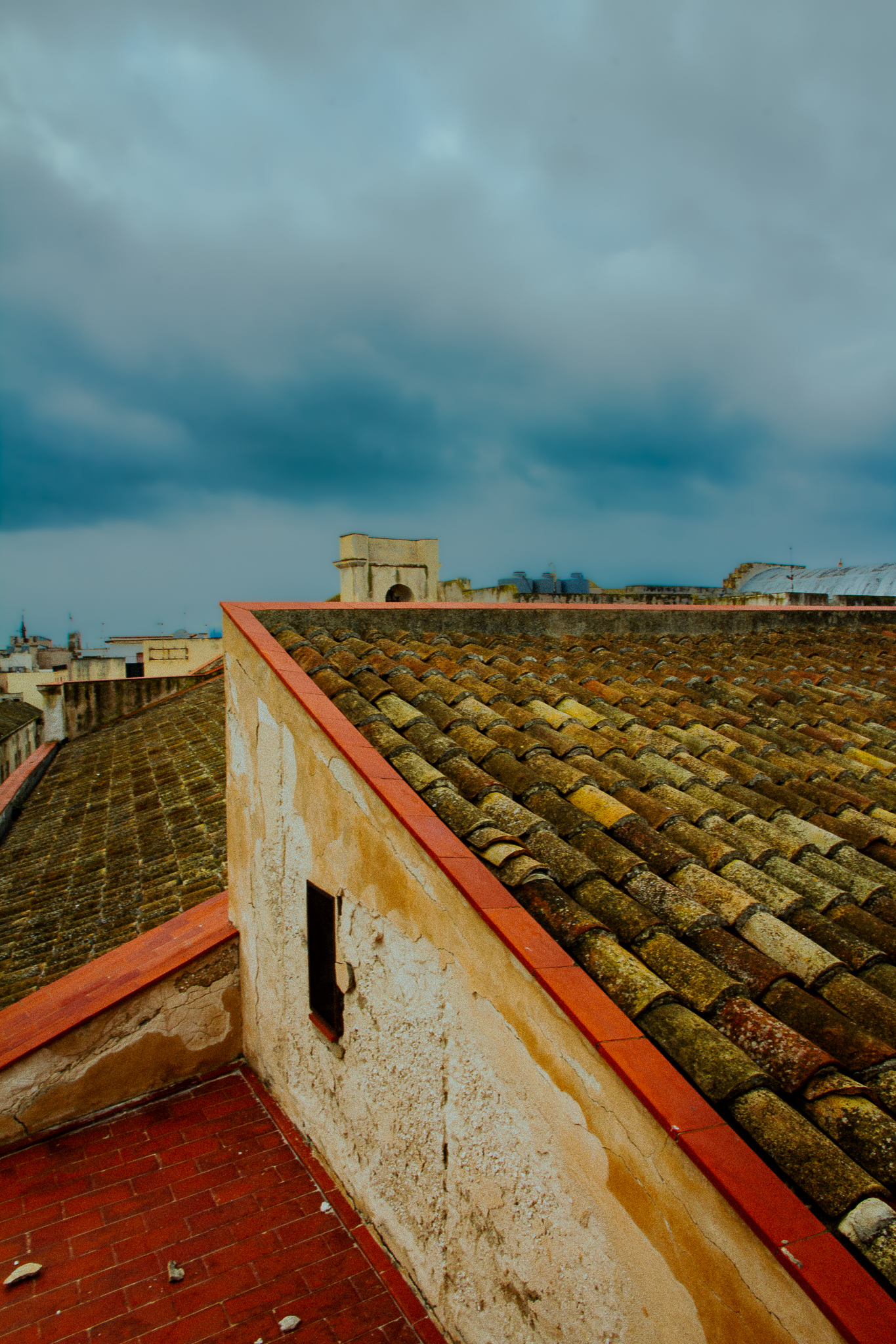 Urban architectural photograph of Trapani and Erice’s historic old town, capturing narrow streets, limestone façades, and traditional stone buildings. 